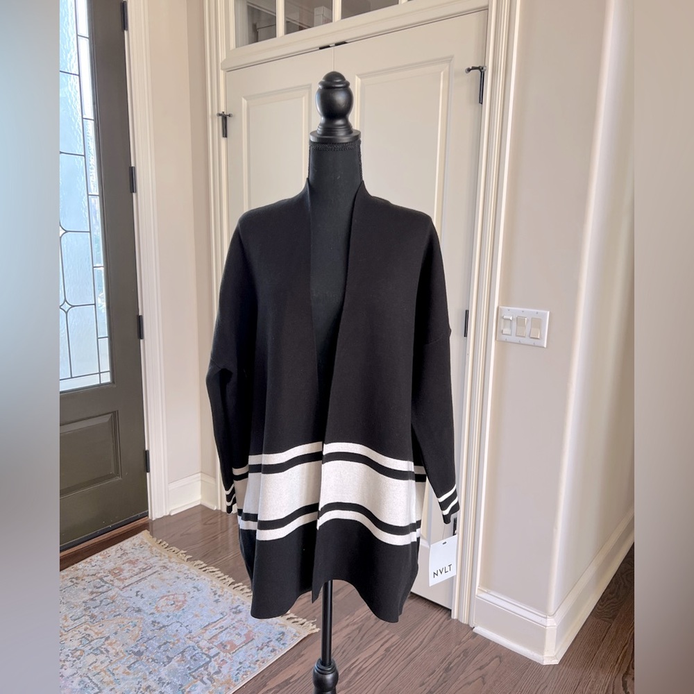 Ladies small open front sweater.